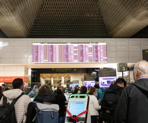 Travellers check in at Lisbon airport