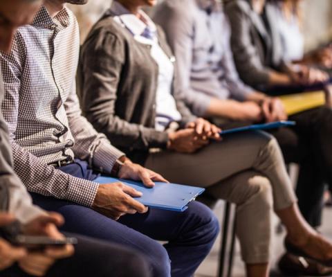 Job candidates wait to be seen for roles