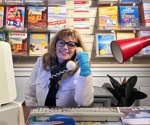 Travel Wallet founder Maggie Rogers sitting at desk
