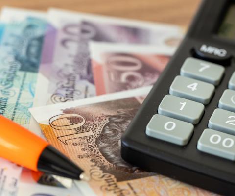 Money next to a calculator