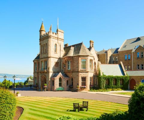 A large castle with blue sky background 