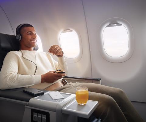 A male customer relaxes onboard with Turkish Airlines