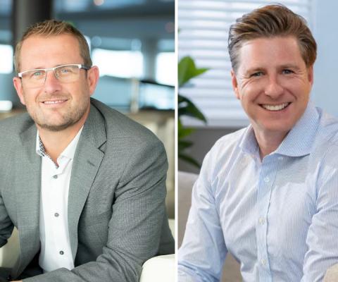 Two smiling white men in suits 