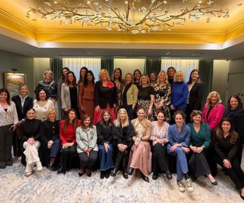 Large group of women smiling 
