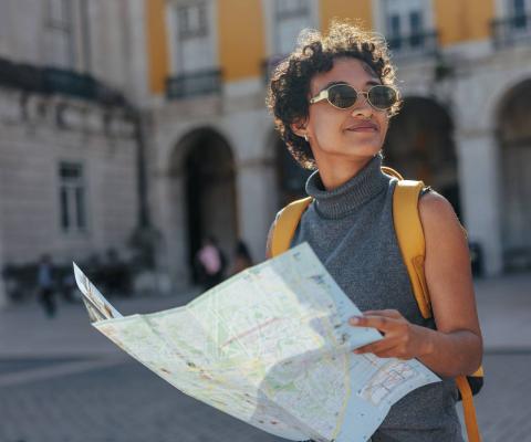 Female traveller looking at a map in Lisbon
