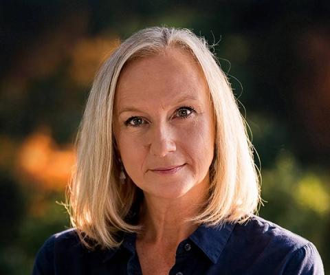Blonde woman with navy shirt 
