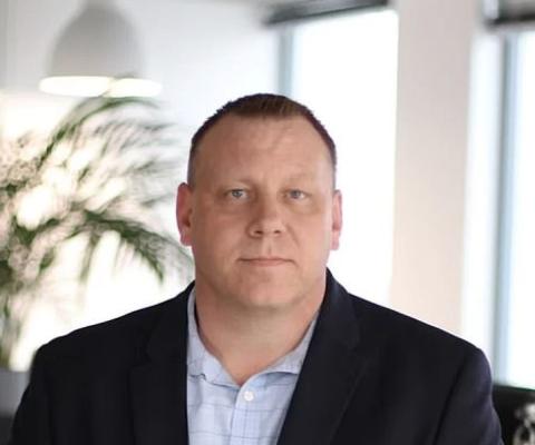 Man in suit headshot 
