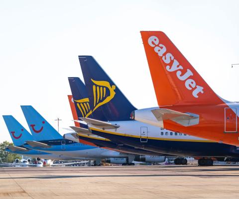 Tui, Ryanair and easyJet aircraft pictured at the stand at an airport