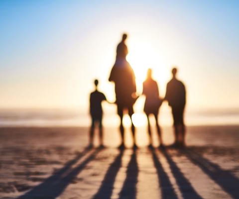 A family play on the beach