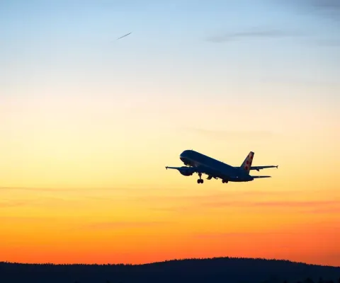 An aircraft taking off at dusk