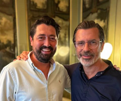 Two white men smiling 