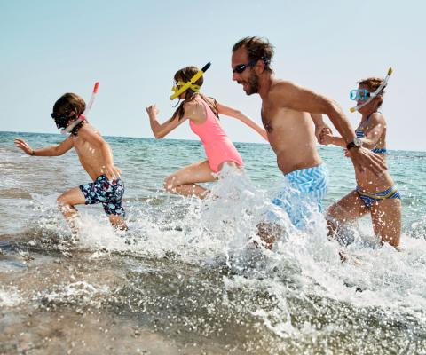 A family splash around in the sea
