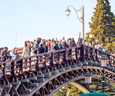 Tourists gather on Venice's Accademia Bridge