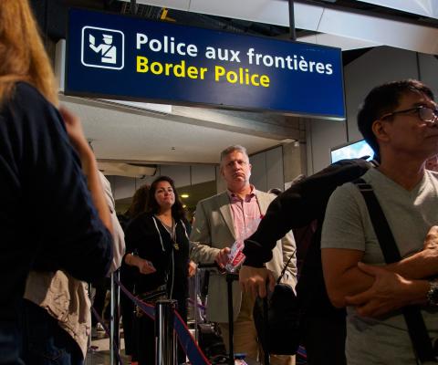 Passenger queue to clear border control at a European airport