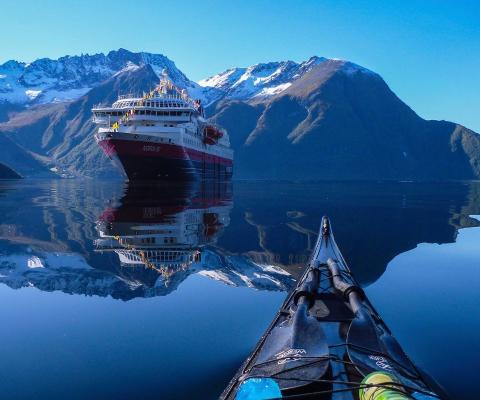 Hurtigruten ship in a fjord in Norway