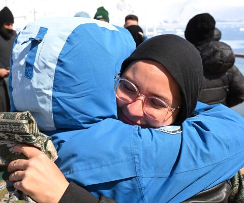 Guests embracing on all-Halal Antartica cruise