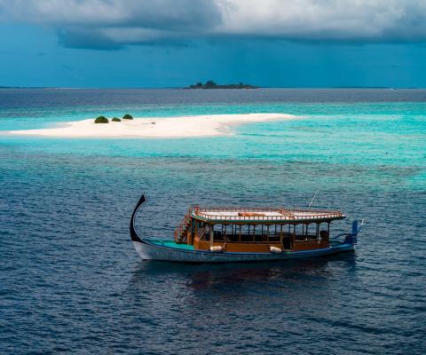 A traditional Maldivian Dhoni boat at sea