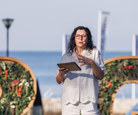 Woman speaking on stage 