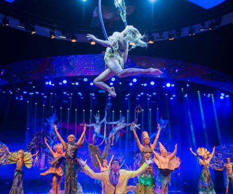 Aerialist performing on a lyra above the stage at WOW - The Vegas Spectacular, Rio Las Vegas