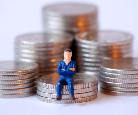 Tax / money - man on coins (stock)