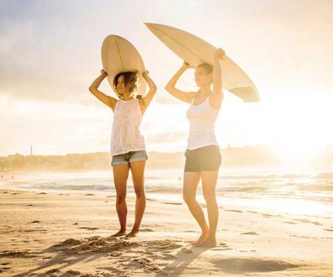 Female surfers on the beach