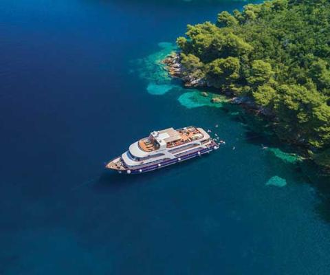 Yacht in crystal blue waters