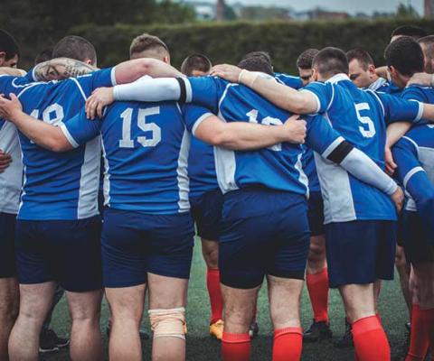 Rugby team huddle