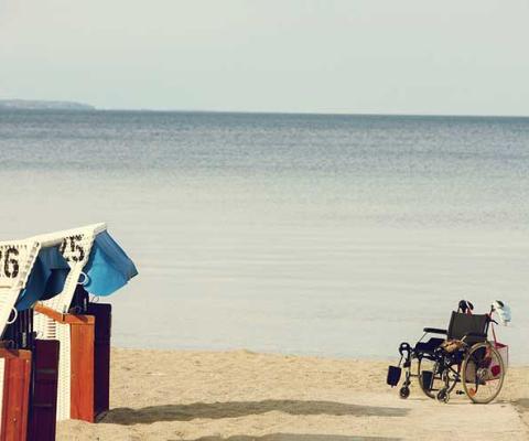 Wheelchair on beach boardwalk, accessibility