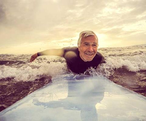 Older man surfing