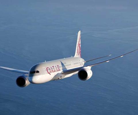 Qatar Airways jet over the ocean