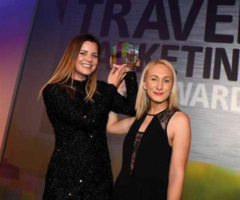 Travel Marketing Awards winners showing trophy
