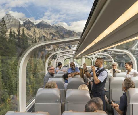 Rocky Mountaineer trains travel through majestic mountain scenery
