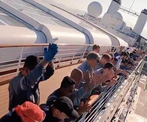 People applauding onboard the MS Rotterdam