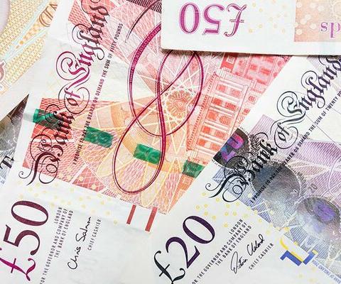 50 pound and 20 pound notes cash money sterling.jpg