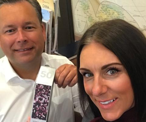 Lee and Deben assistant manager Abigail Nunn with the team's trophy