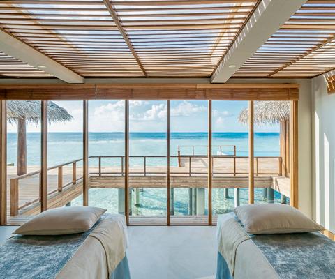 Anantara Kihavah's two-bedroom overwater pool residence's spa treatment room