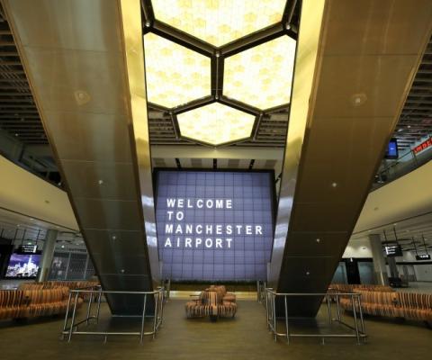 A honeycomb-inspired lighting feature serves as a centrepiece for the terminal (Credit: Manchester Airport)