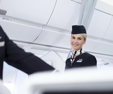 Finnair_A350_economy_class_flight_attendants_smiling_3.jpg