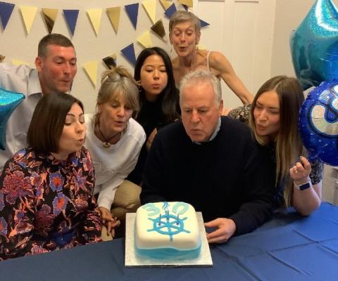 Rupert Thomson celebrates with some of the Light Blue Travel team