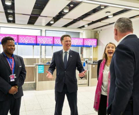 Courts (centre) met with airport and airline staff during his visit