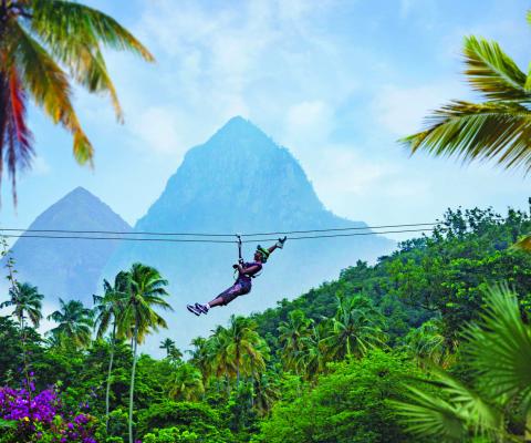 The guide features an array of activities including zip-lining, sailing, surfing, snorkelling, and whale, dolphin and turtle watching