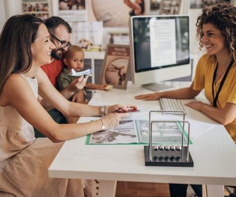 Family travel agent travel agency child iStock-1338040171 (Credit: iStock)