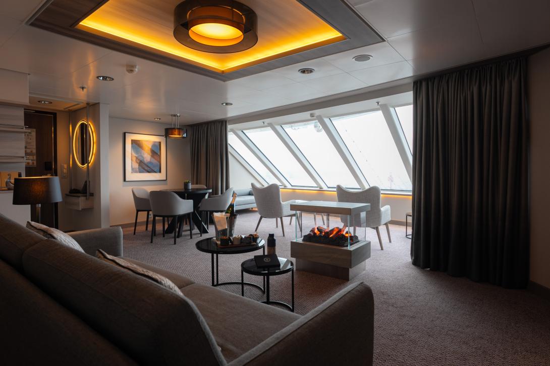 Spacious suite onboard a ship with large windows