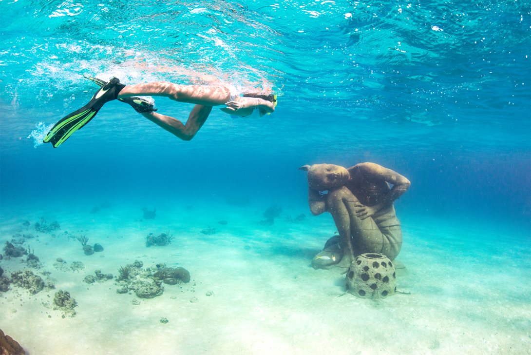 (credit: Nassau & Paradise Island Promotion Board) Person snorkelling by underwater sculpture