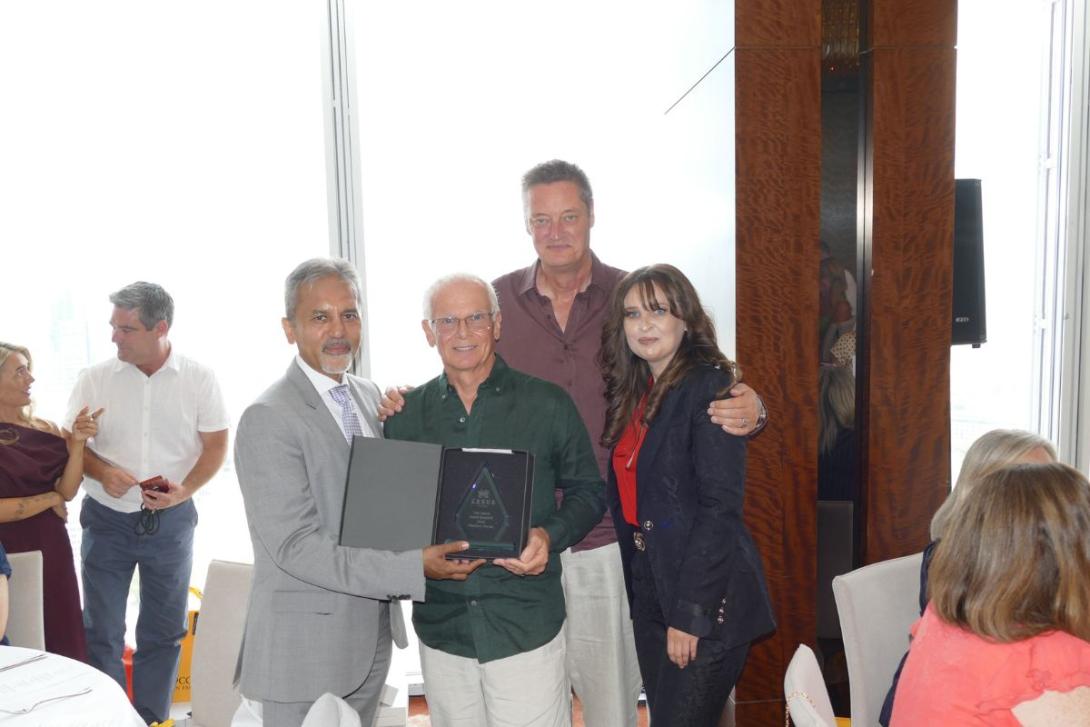 Group of people holding awards