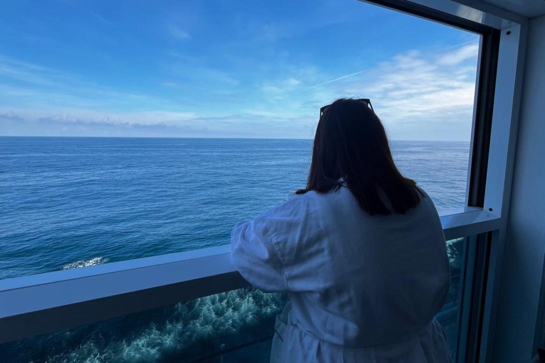 Eleanor Roche, Travel Counsellors Eleanor Roche looking over her Infinite Veranda balcony in her robe
