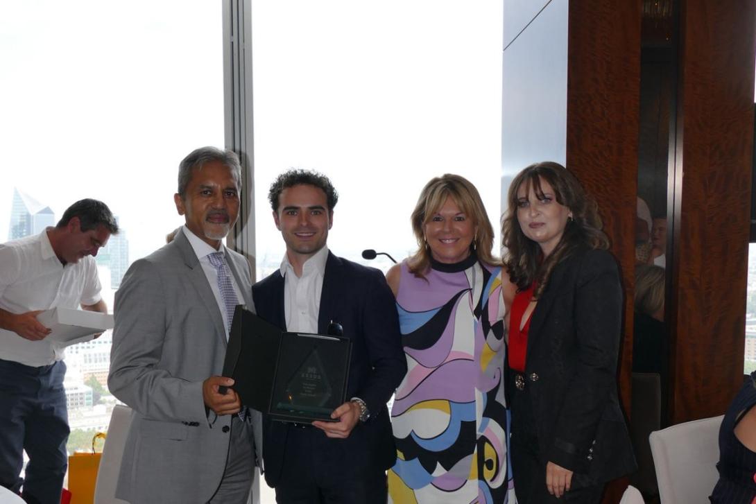 Group of people holding awards
