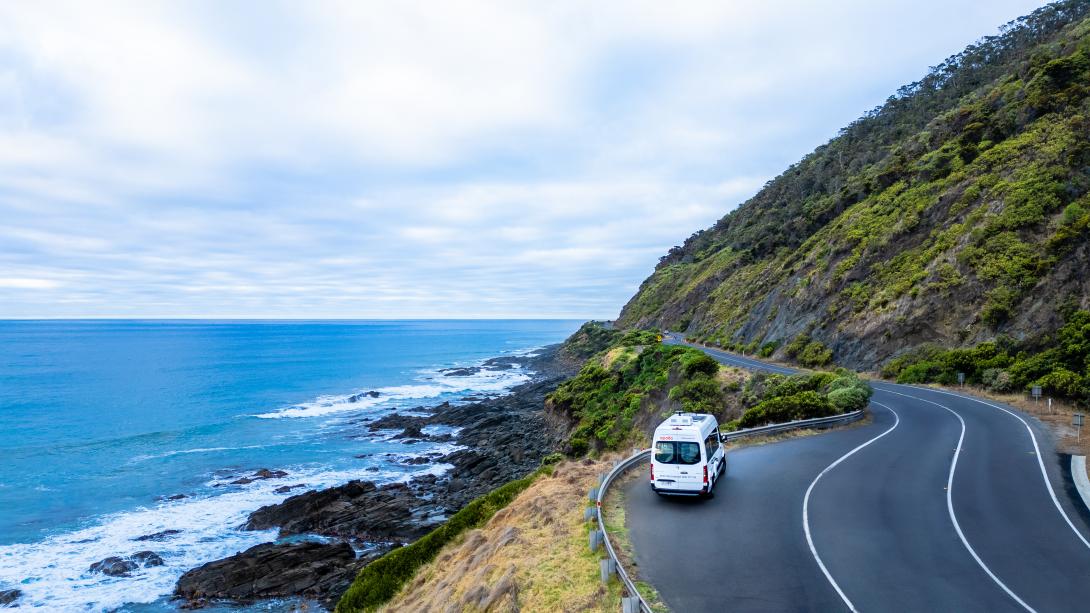 A motorhome driving near the ocean