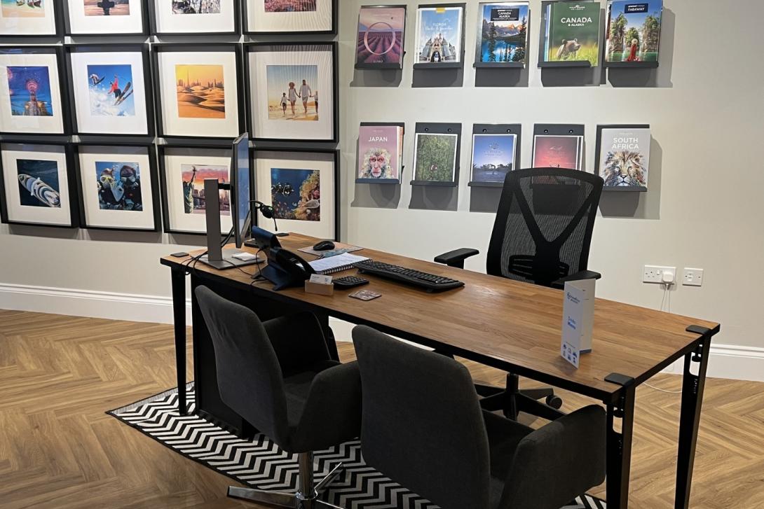 Desk with two black chairs