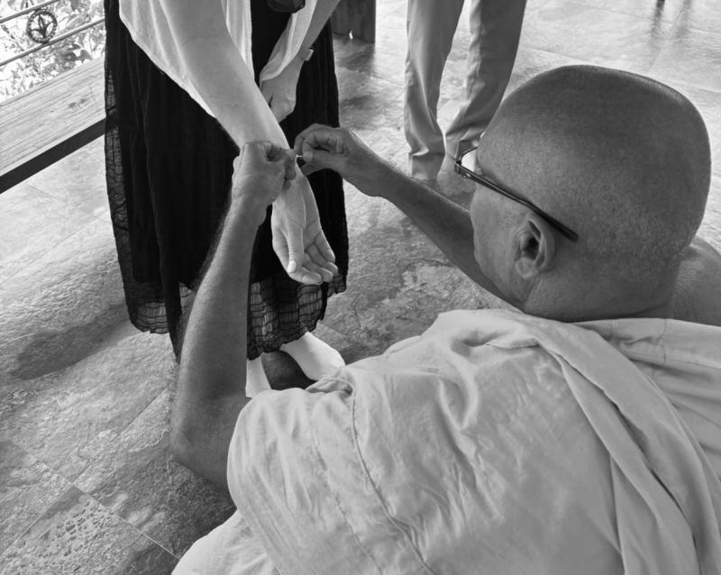 Caroline being blessed by monk